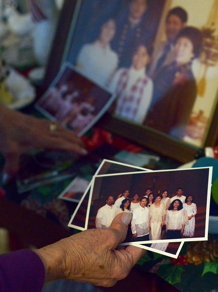 Alicia Molina looks through family photos